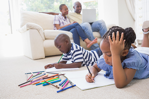 children drawing at home with family
